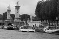 The barges are anchored at the waterfront on the river Seine. Royalty Free Stock Photo